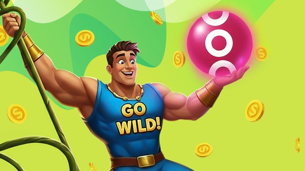 On a green background, a buff man wearing a blue “go wild!” tank top swings on a vine, holding a pink circle with the SlotsLV Casino logo.