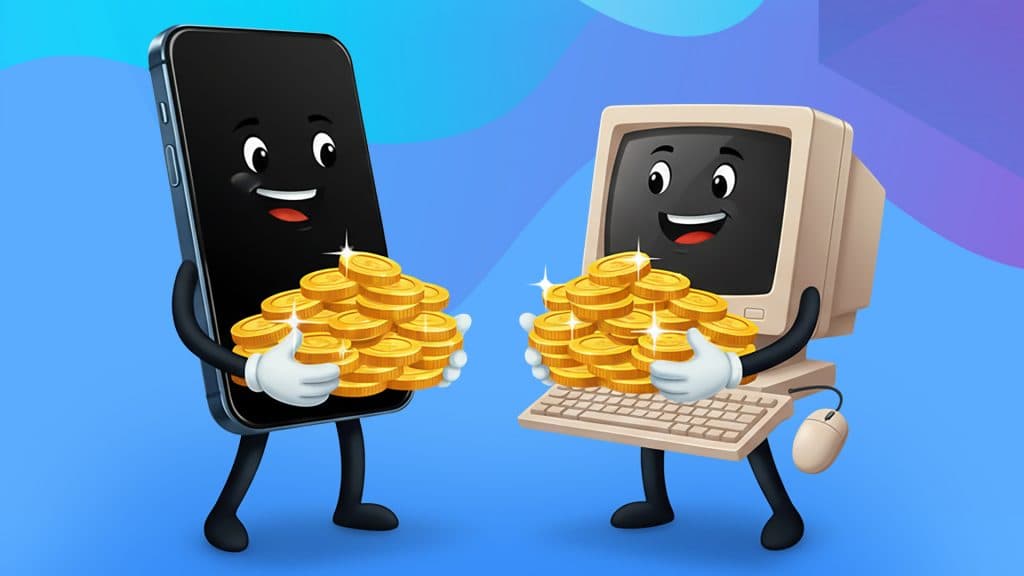 Holding a pile of gold coins, a mobile phone with a black screen and a smiling face faces a desktop with a keyboard and mouse, also holding a pile of coins.