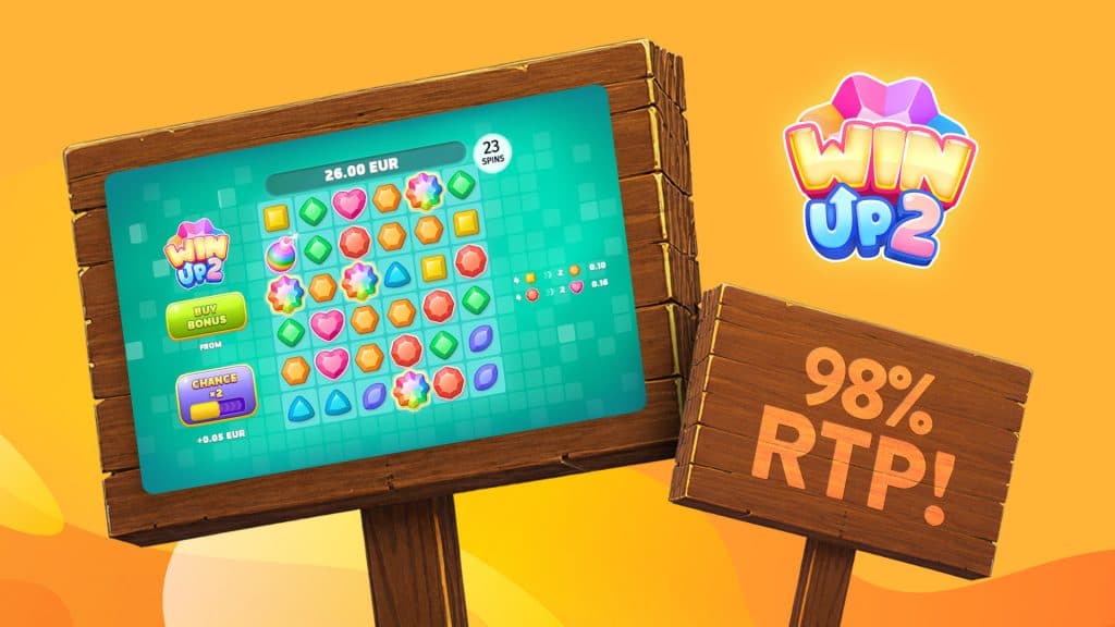 The high payout slot game Win Up 2 plays on a wooden picket sign beside another wooden sign that shows its 98% RTP.