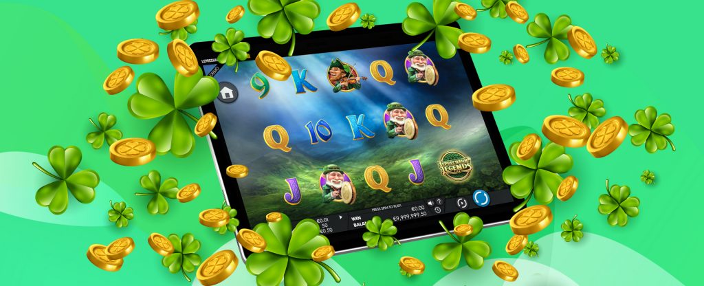 An iPad is showing a screenshot of the slots features in the SlotsLV slot game, Leprechaun Legends, surrounded by gold coins and four-leaf clovers, set against a green abstract background.