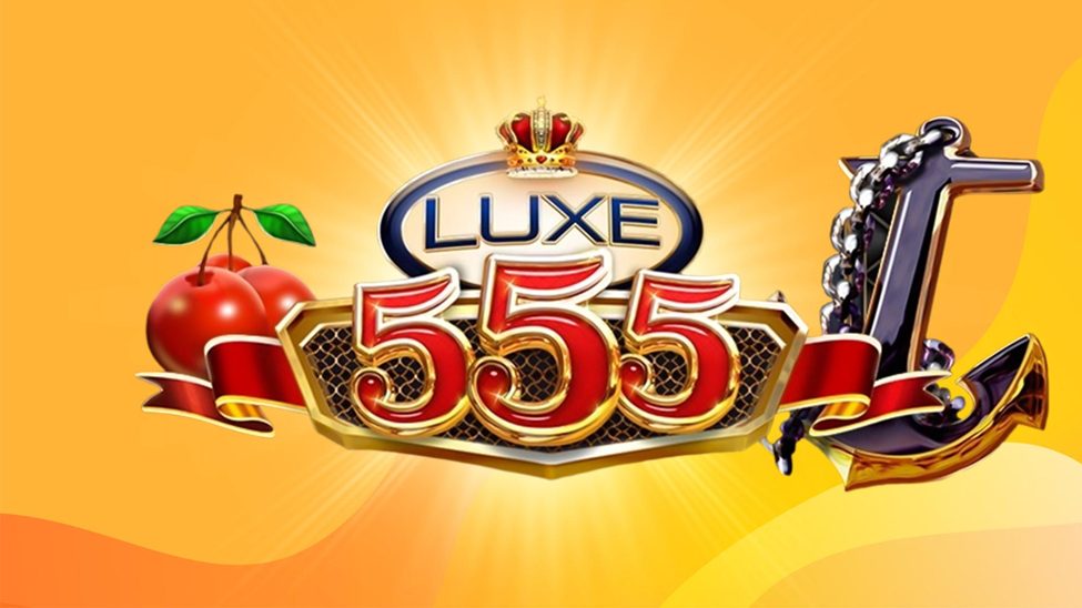 The gold words ‘Luxe 555’ are surrounded by apples and cherries on a gold background.