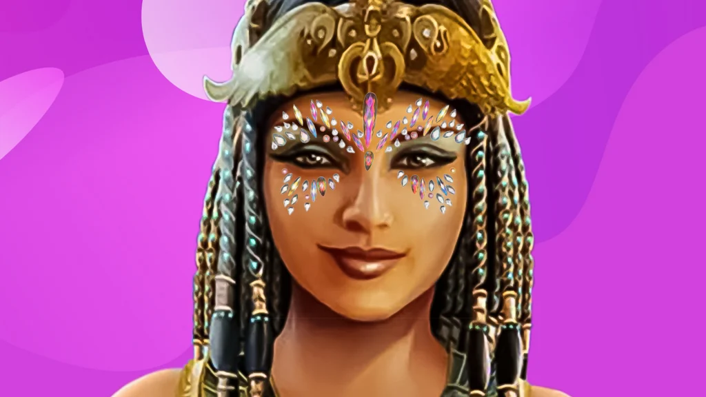 Cleo’s face is front and center with crystals lining her eyes and a golden crown on her head, and it’s all displayed on a purple background.