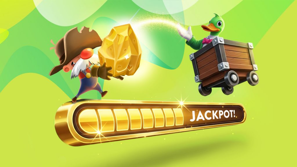 A prospector with a bushy grey mustache holds a massive gold diamond over a bar that says, Jackpot!”. Also on the bar is a duck in a go-kart releasing a stream of glittery light toward the prospector.
